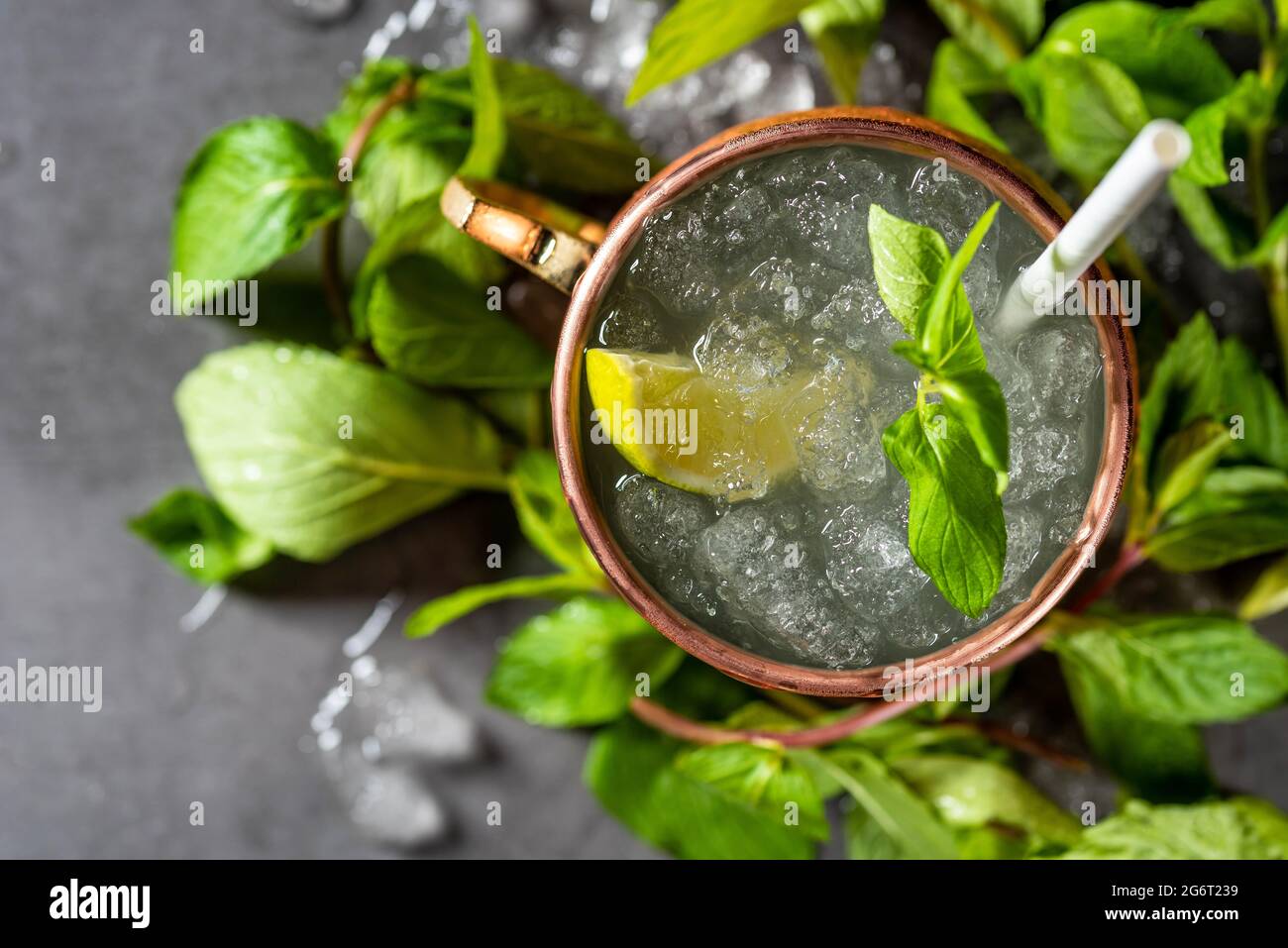Moscow mule cocktail in copper cup with lime, ginger beer, vodka and mint garnish Stock Photo