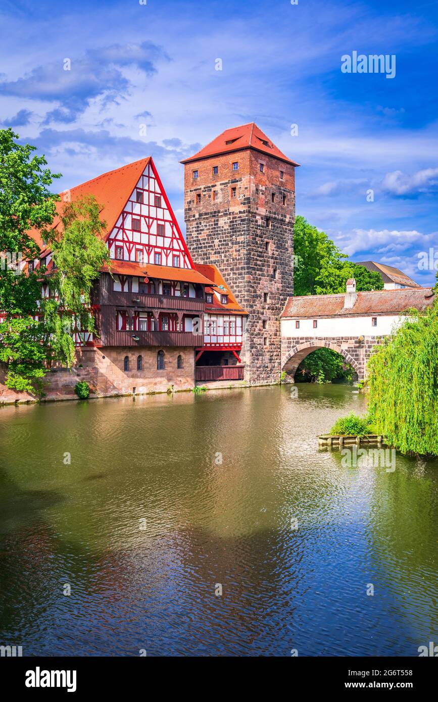 Nuremberg, Germany. Colourful and picturesque view of the half-timbered old houses on the banks of the Pegnitz river, Maxbrucke Bridge. Travel landmar Stock Photo