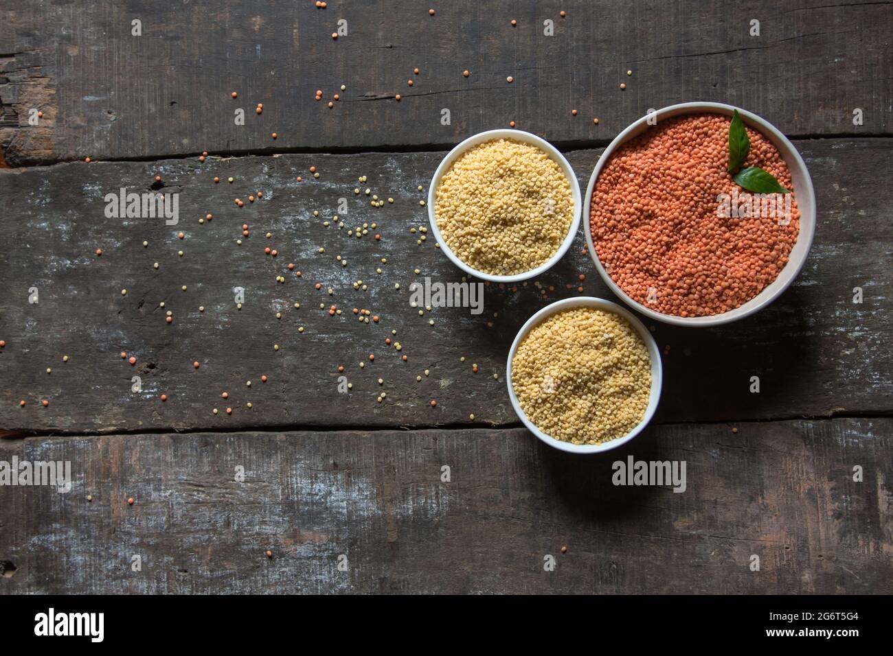 View from top of red and yellow lentils food background. Moong and masoor dal also known as yellow and red lentils respectively. Stock Photo