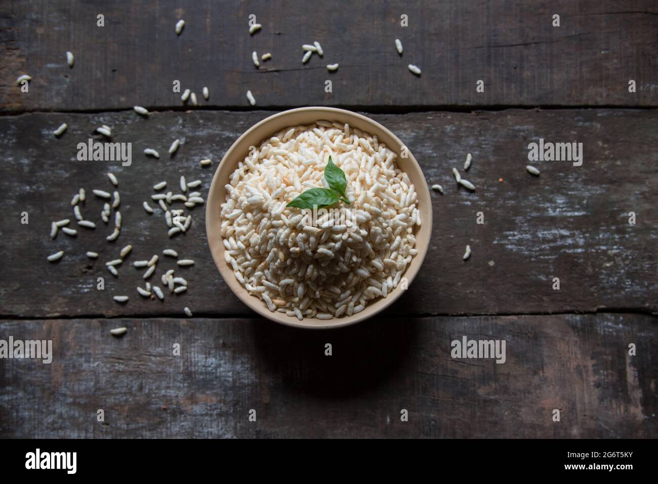Puffed rice or muri in a heap in a bowl. Top view, selective focus. Stock Photo