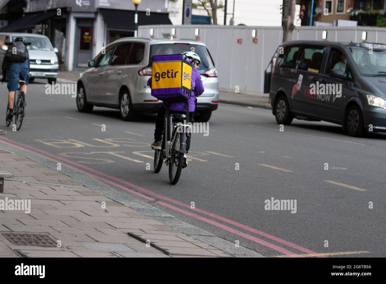 Electric bike rider of app based Getir start-up grocery delivery company, in London Stock Photo