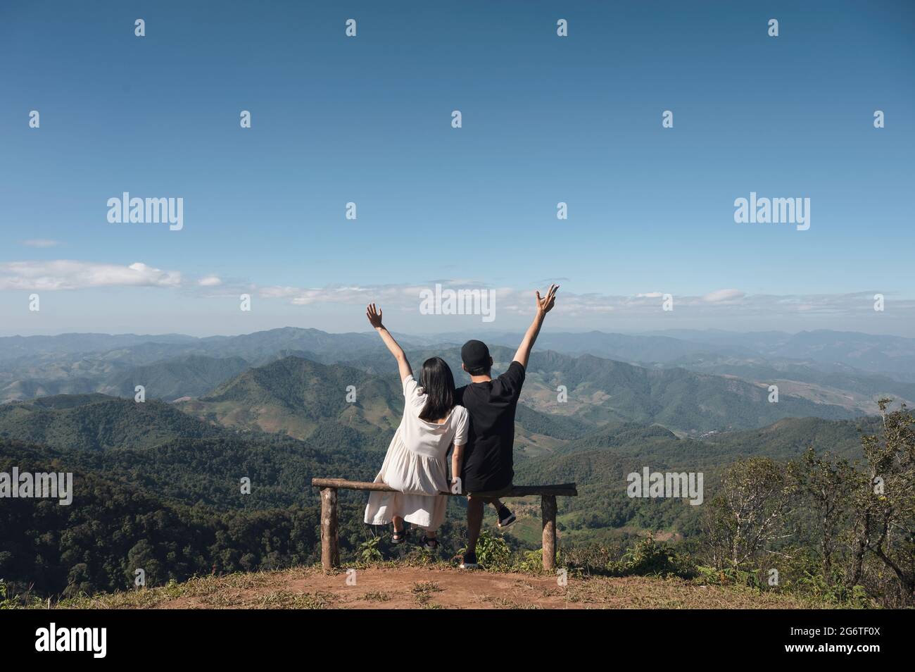 Couple sitting on top hill hi-res stock photography and images - Alamy