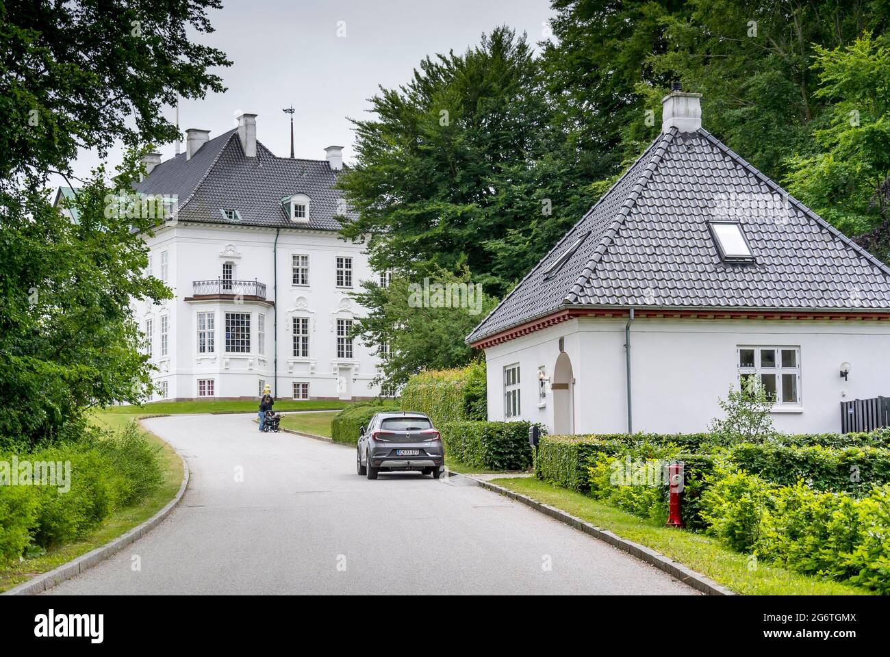 Aarhus, Denmark - 27 June 2021: The exterior of the Royal Marselisborg Palace, People visit the garden around the castle Stock Photo