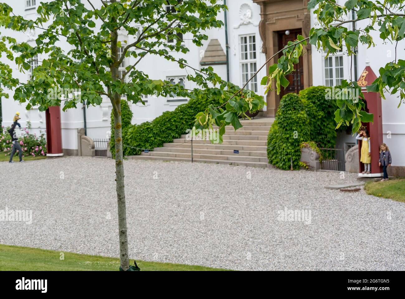 Aarhus, Denmark - 27 June 2021: The exterior of the Royal Marselisborg Palace, People visit the garden around the castle Stock Photo