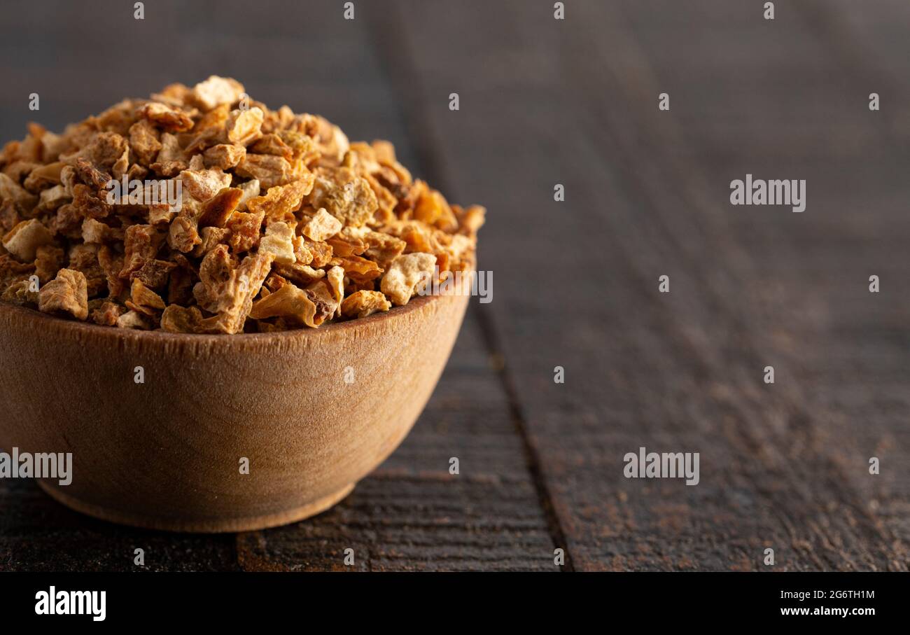 Dehydrated Lemon Peel on a Rustic Wooden Table Stock Photo