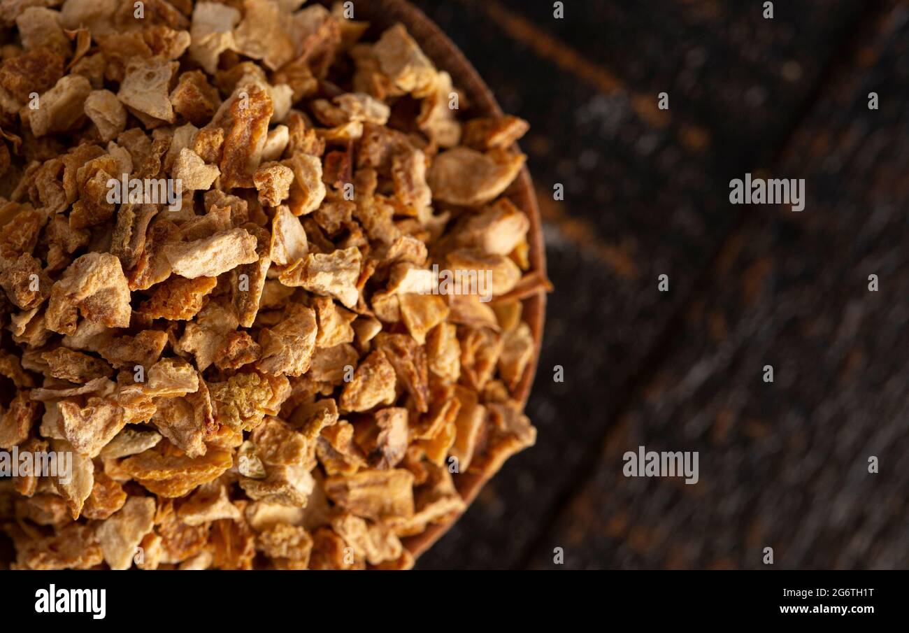 Dehydrated Lemon Peel on a Rustic Wooden Table Stock Photo