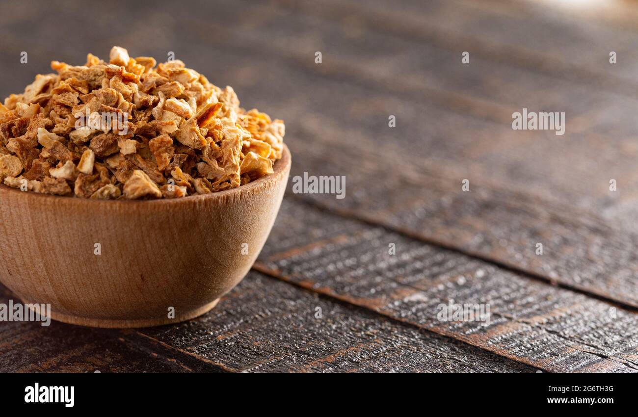 Dehydrated Lemon Peel on a Rustic Wooden Table Stock Photo