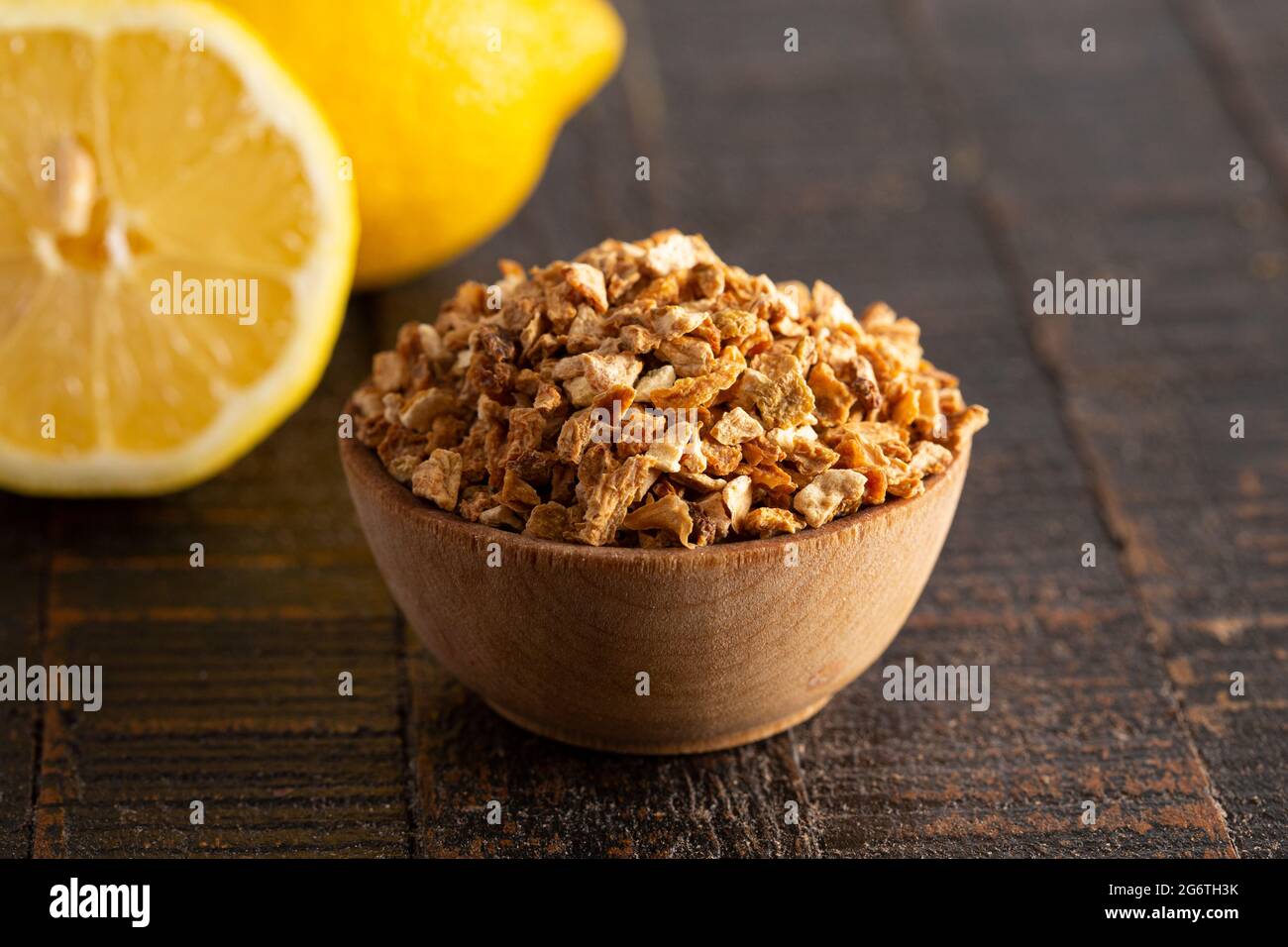 Dehydrated Lemon Peel on a Rustic Wooden Table Stock Photo