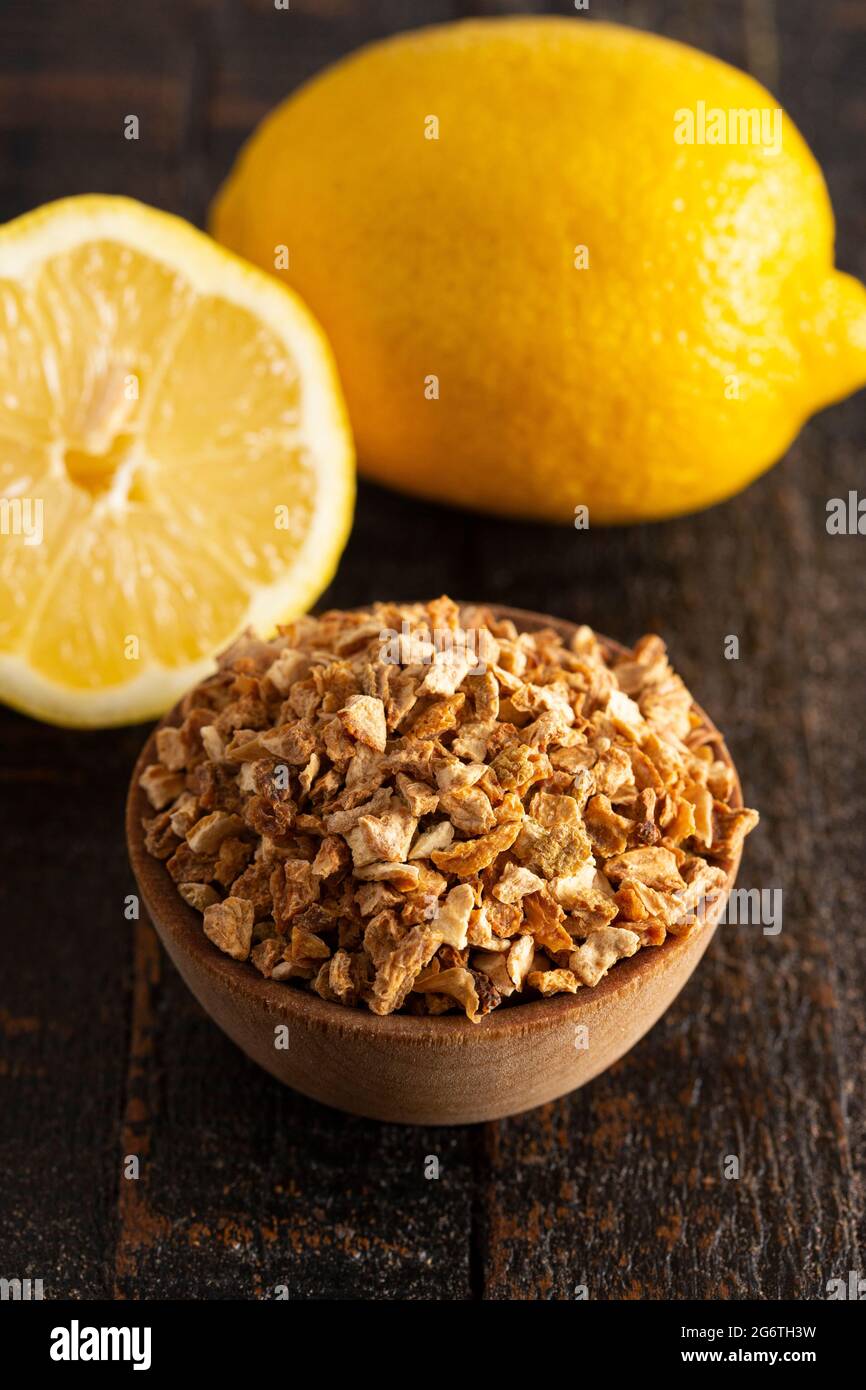 Dehydrated Lemon Peel on a Rustic Wooden Table Stock Photo