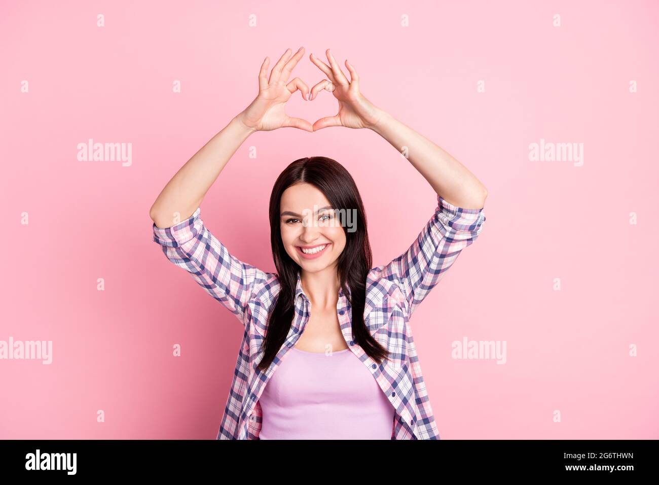 Photo of peaceful coquette girlfriend make heart symbol wear plaid ...