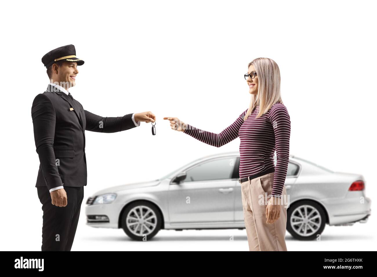 Woman giving car keys from a silver car to a chauffeur isolated on white background Stock Photo