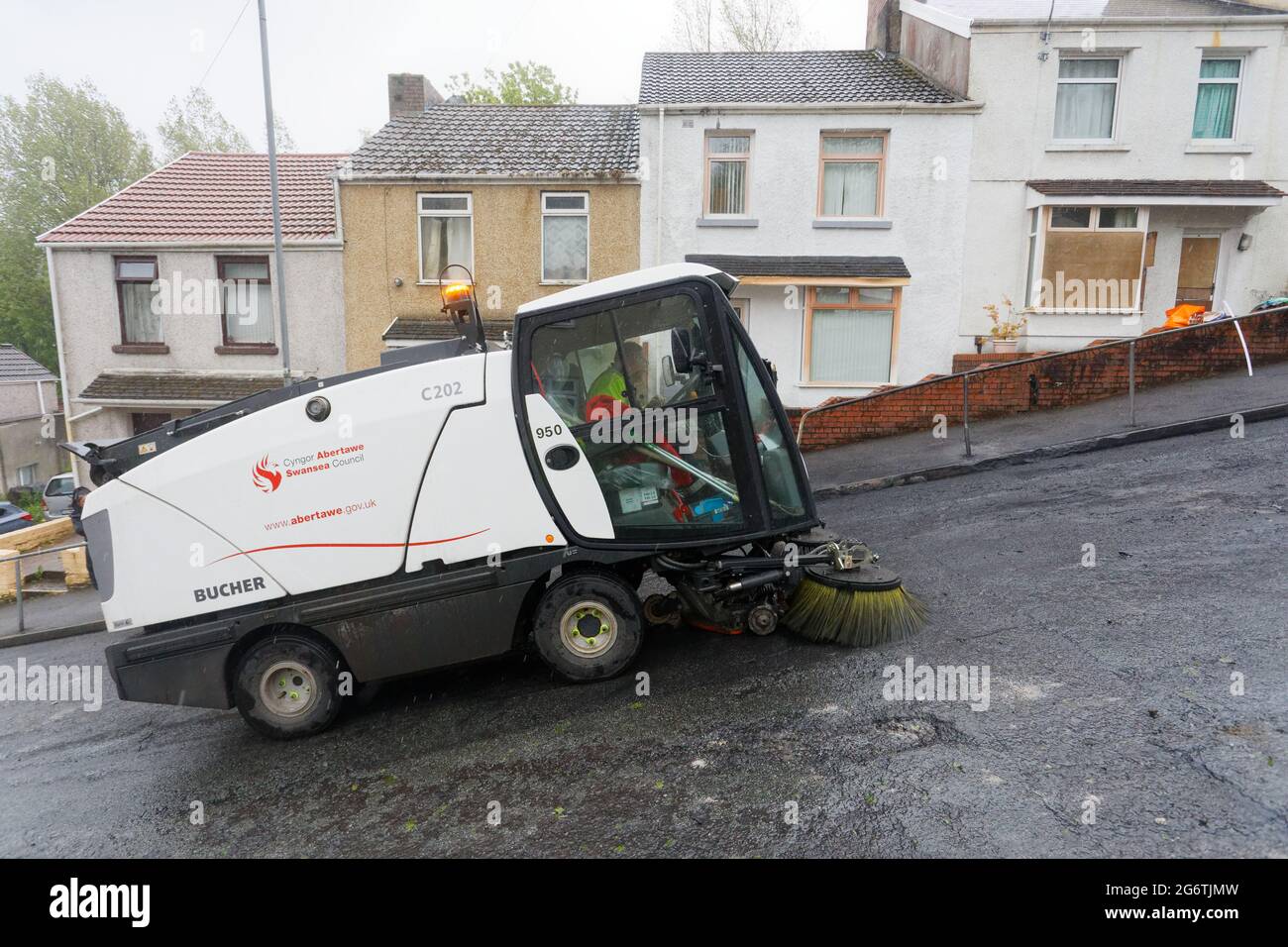 Pictured: A Council brush cleans up in Waun-Wen Road in the Mayhill area of Swansea, Wales, UK. Friday 21 May 2021 Re: Gangs of 'yobs' have been setti Stock Photo