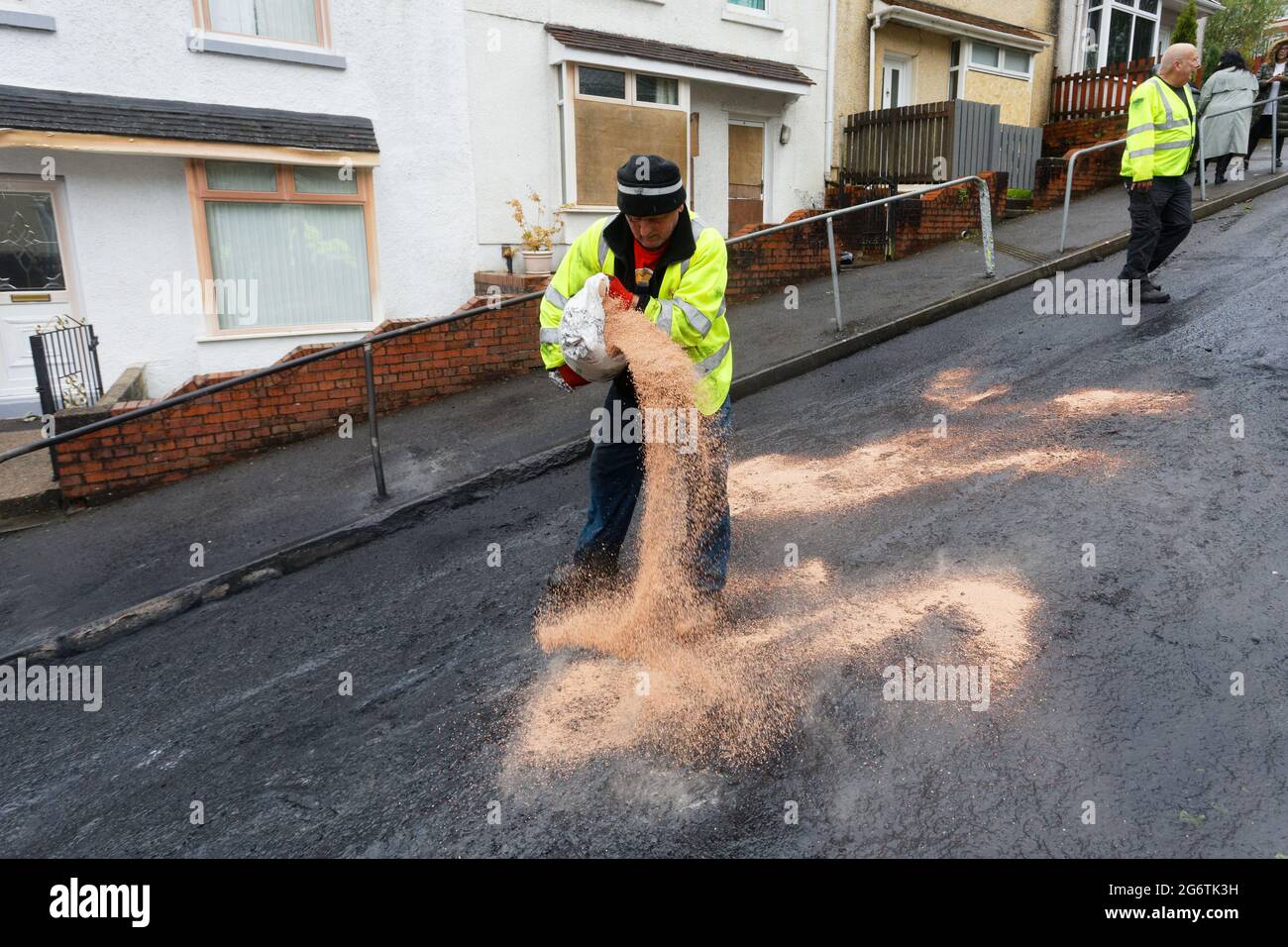 Pictured Council workers clean up in WaunWen Road in the Mayhill area