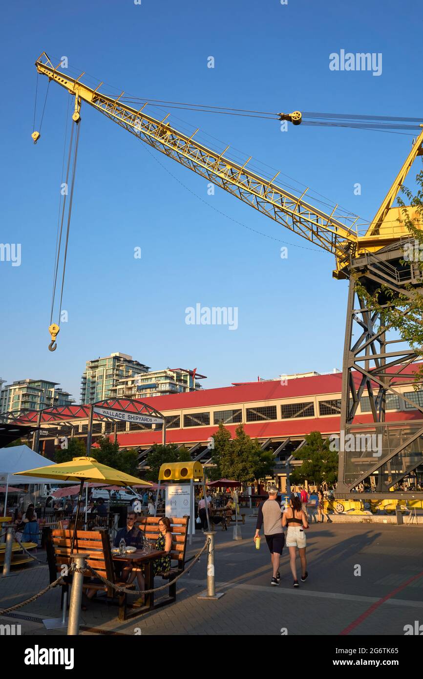 People relaxing outdoors at the Shipyards Commons community development in  North Vancouver, British Columbia, Canada Stock Photo