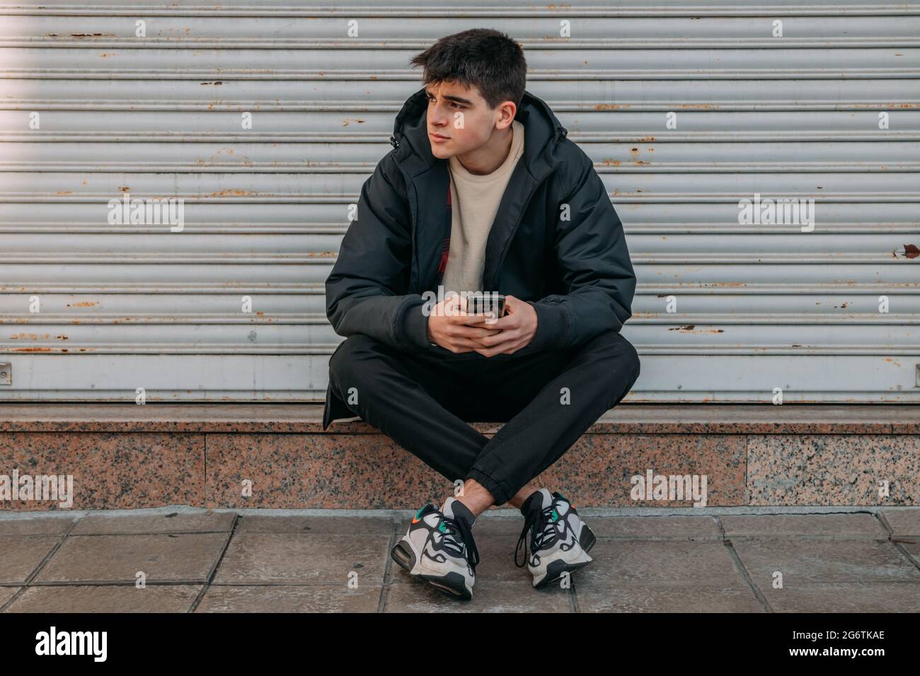 Teenager sitting waiting hi-res stock photography and images - Alamy