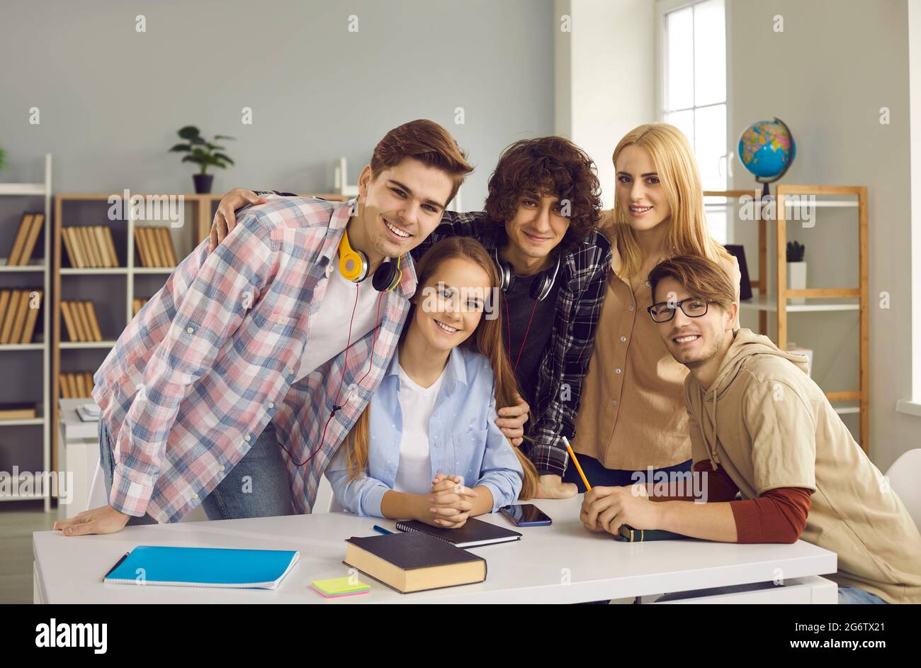 Smart and modern high school or college students sitting and standing