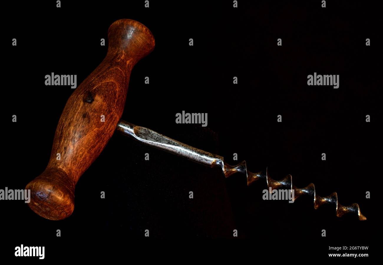 geschmiedeter Korkenzieher mit Holzgriff, forged corkscrew with wooden handle Stock Photo
