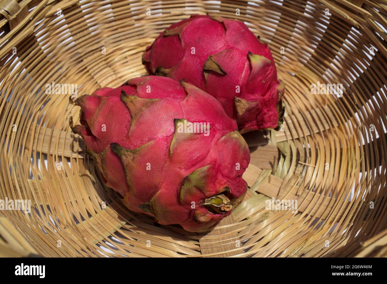 Exotic fruit called Dragon fruit, cactus pitahaya red color plucked in  bamboo wicker basket. Unique different fruit bought in india Asia Stock  Photo - Alamy