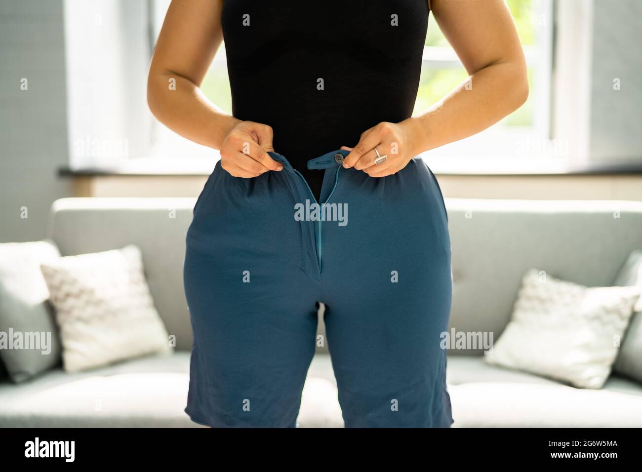 Woman With Weight Gain. Fat Belly Button Stock Photo
