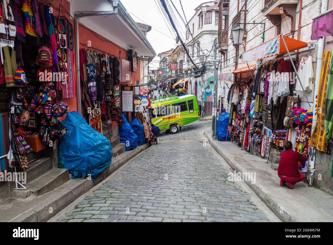 LA PAZ, BOLIVIA - APRIL 28, 2015: People walk a small alley in the center of La Paz, Bolivia. Stock Photo