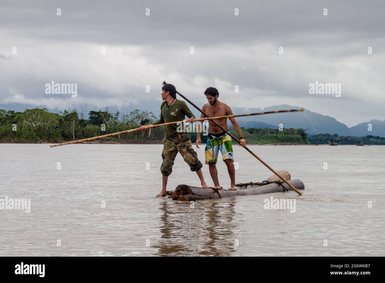 MADIDI, BOLIVIA - MAY 7, 2105: Tourist with a tour guide on Beni river in Madidi National Park, Bolivia Stock Photo