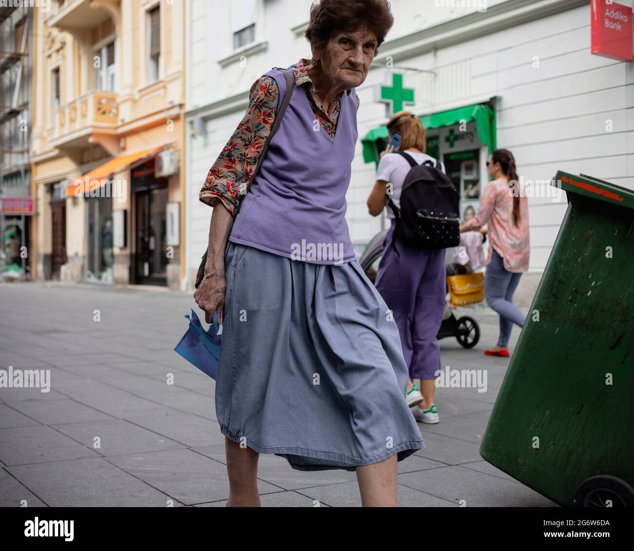 Belgrade, Serbia, Sep 12, 2019: Elderly woman walking down the street Stock Photo