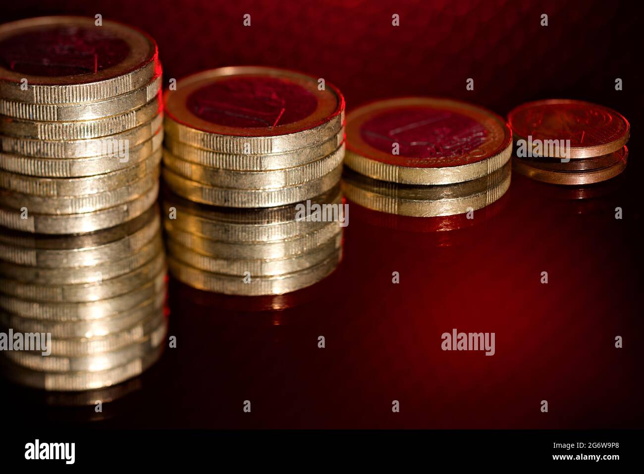 Fast devaluation money cash coins negative interest rate, inflation and debt fund Stock Photo