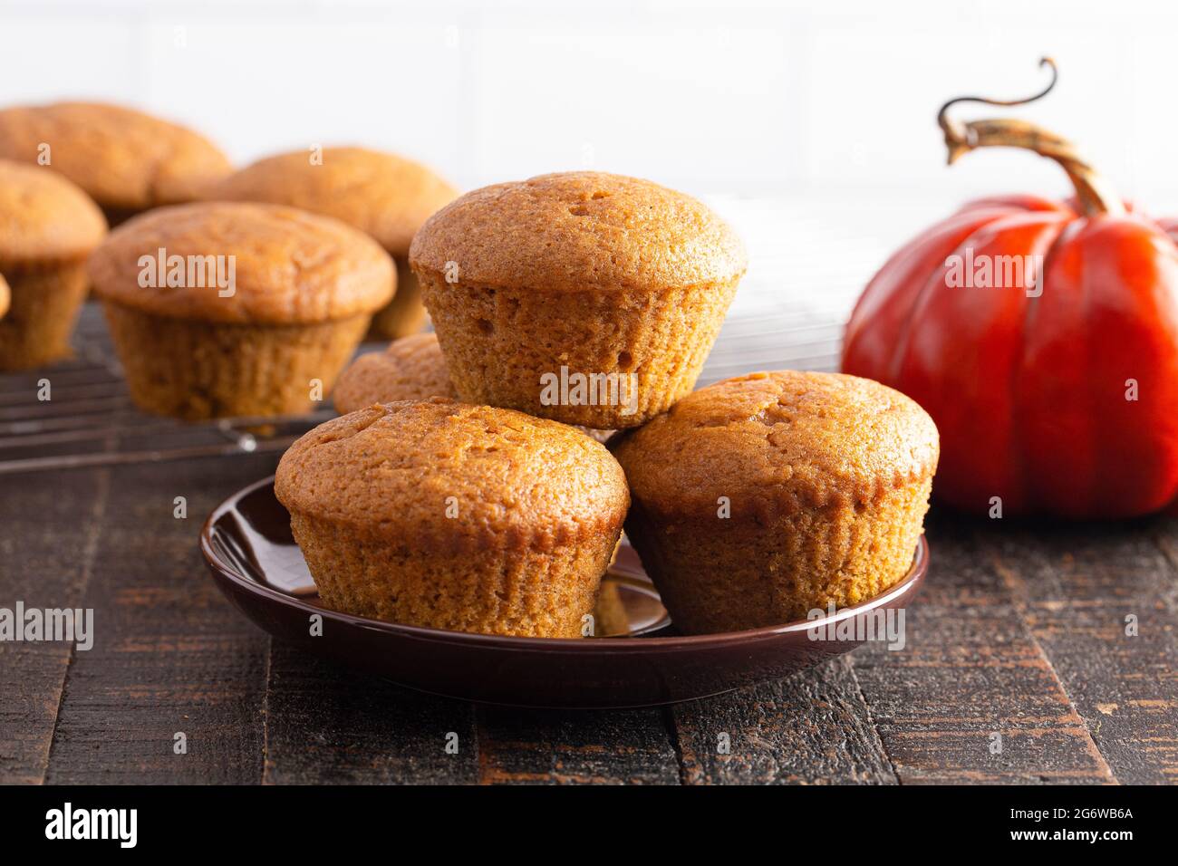 Pumpkin Spice Muffins on a Rustic Wooden Table Stock Photo