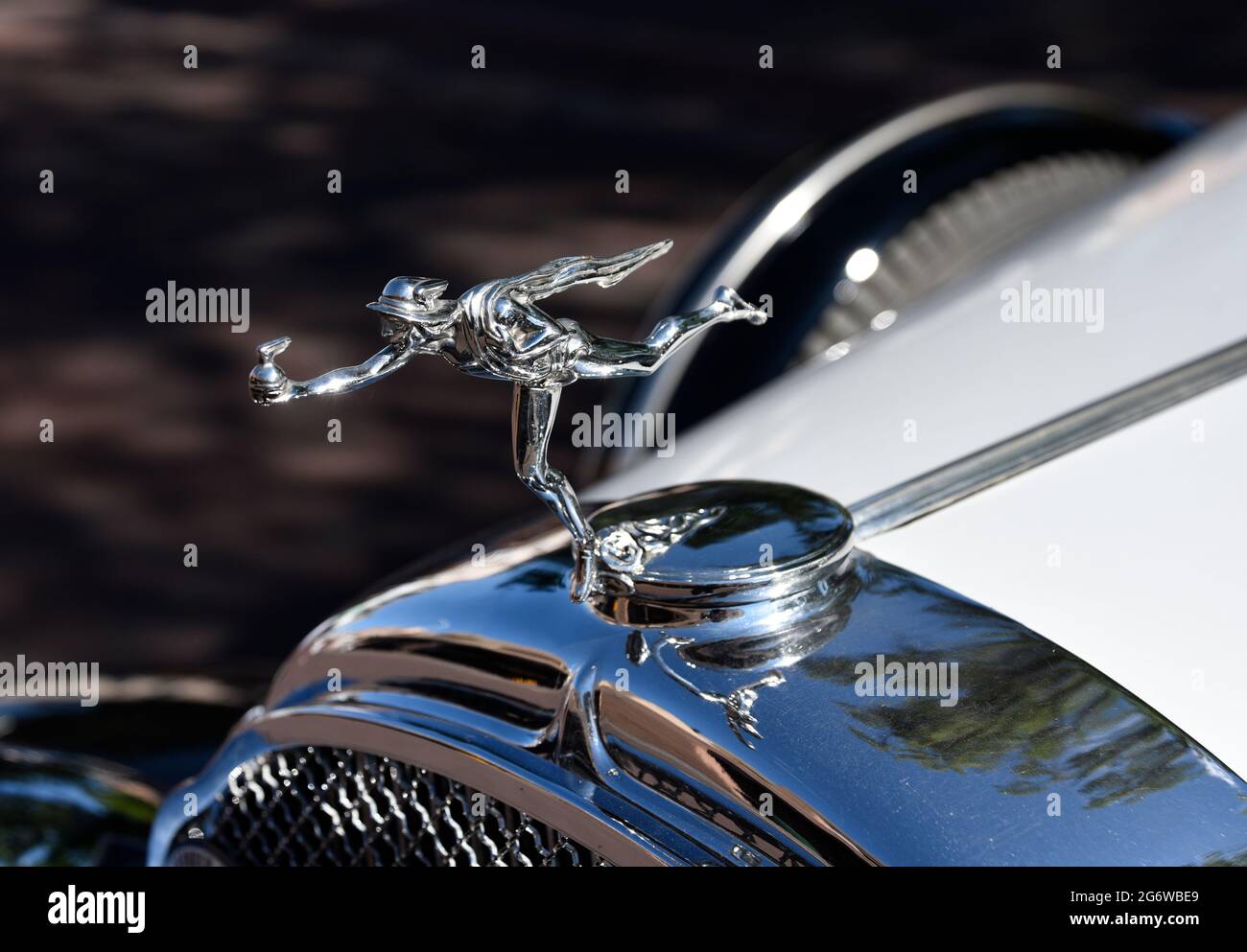 A Mercury Man of Fire hood ornament on the front of a 1932 Buick sedan on display at a Fourth of July car show in Santa Fe, New Mexico. Stock Photo