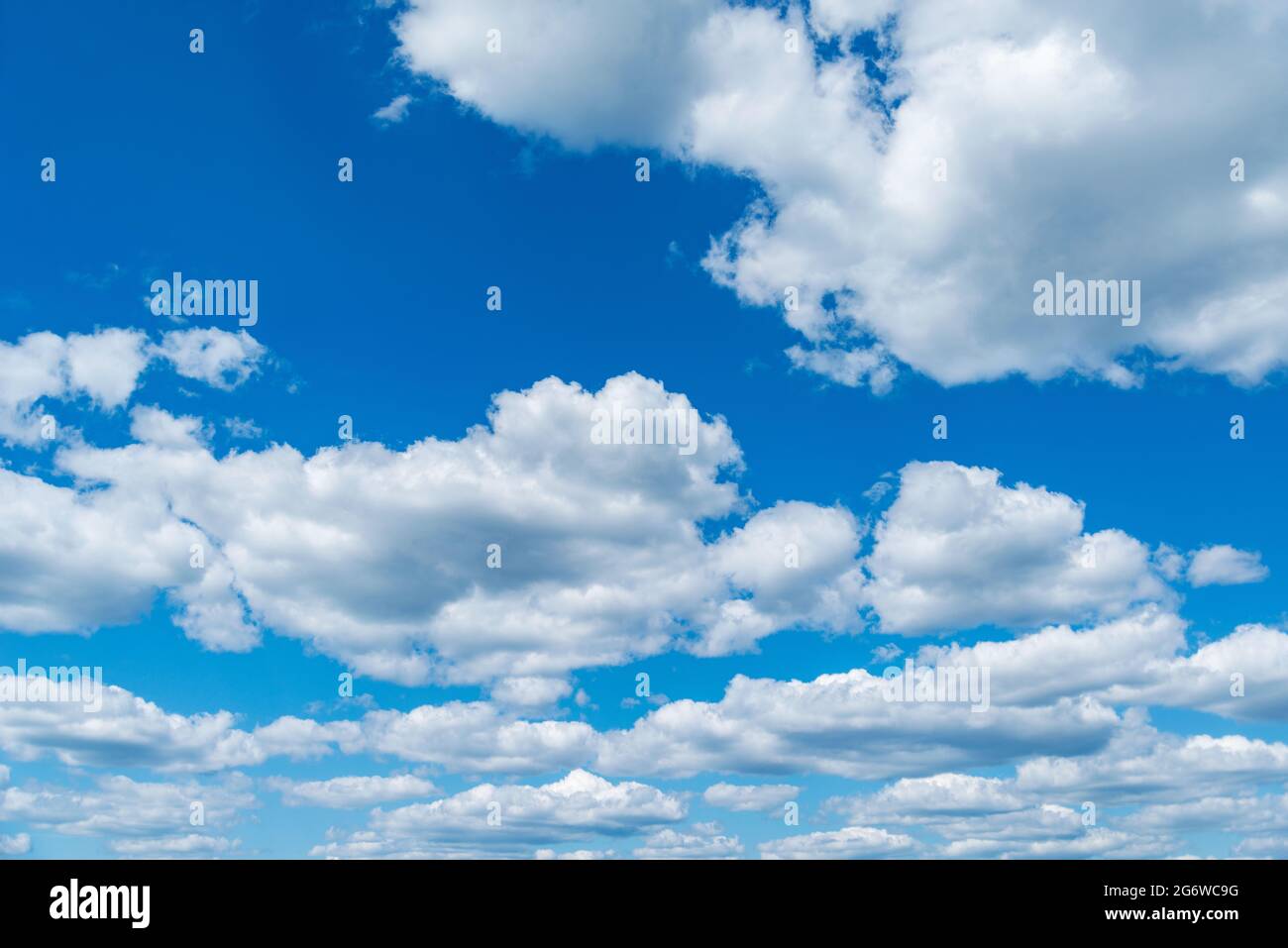 Small clouds on the blue sky. Cloudscape at day time. Stock Photo