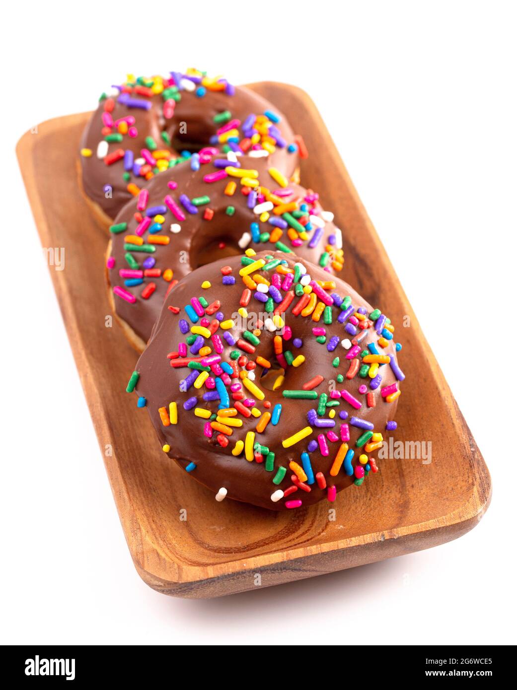Cake Donut with Chocolate Frosting and Rainbow Colored Sprinkles Stock