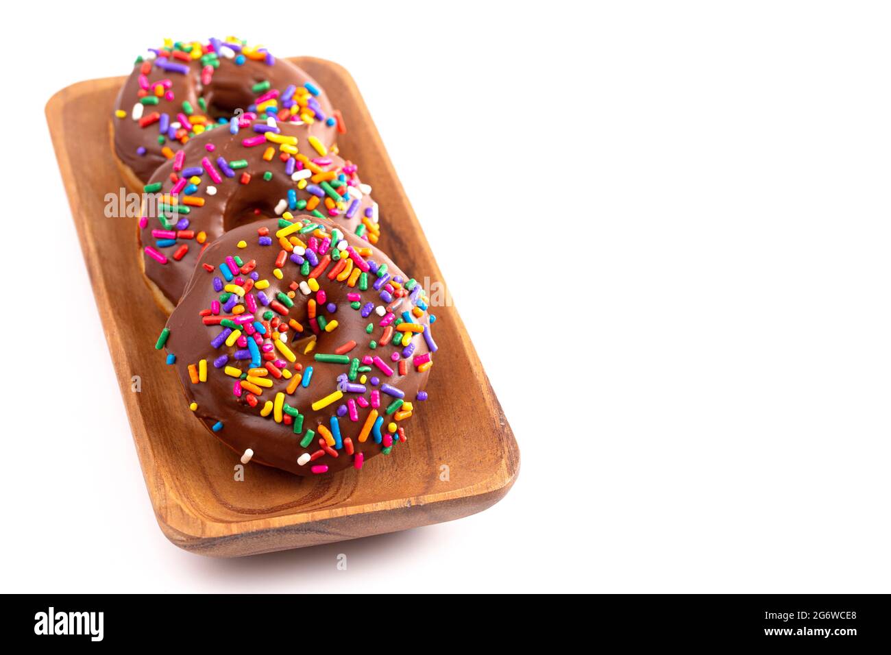 Cake Donut with Chocolate Frosting and Rainbow Colored Sprinkles Stock