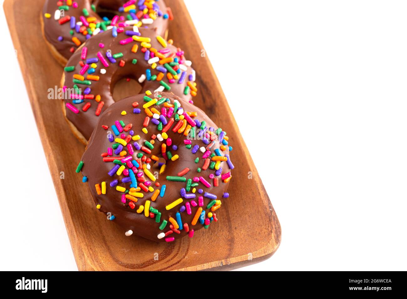 Cake Donut with Chocolate Frosting and Rainbow Colored Sprinkles Stock