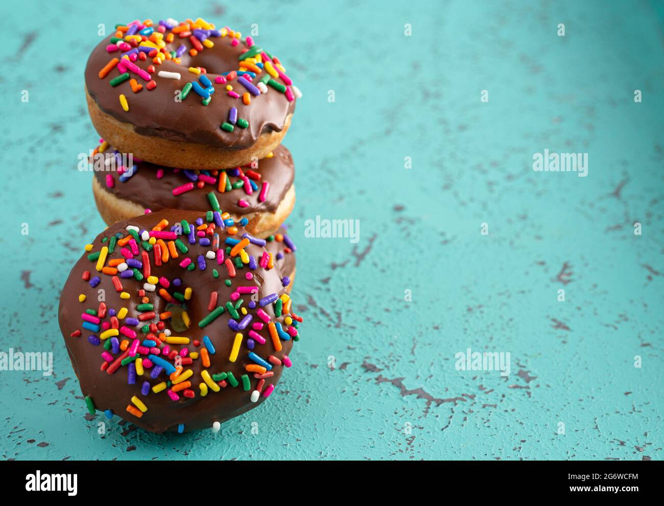 Cake Donut with Chocolate Frosting and Rainbow Colored Sprinkles Stock