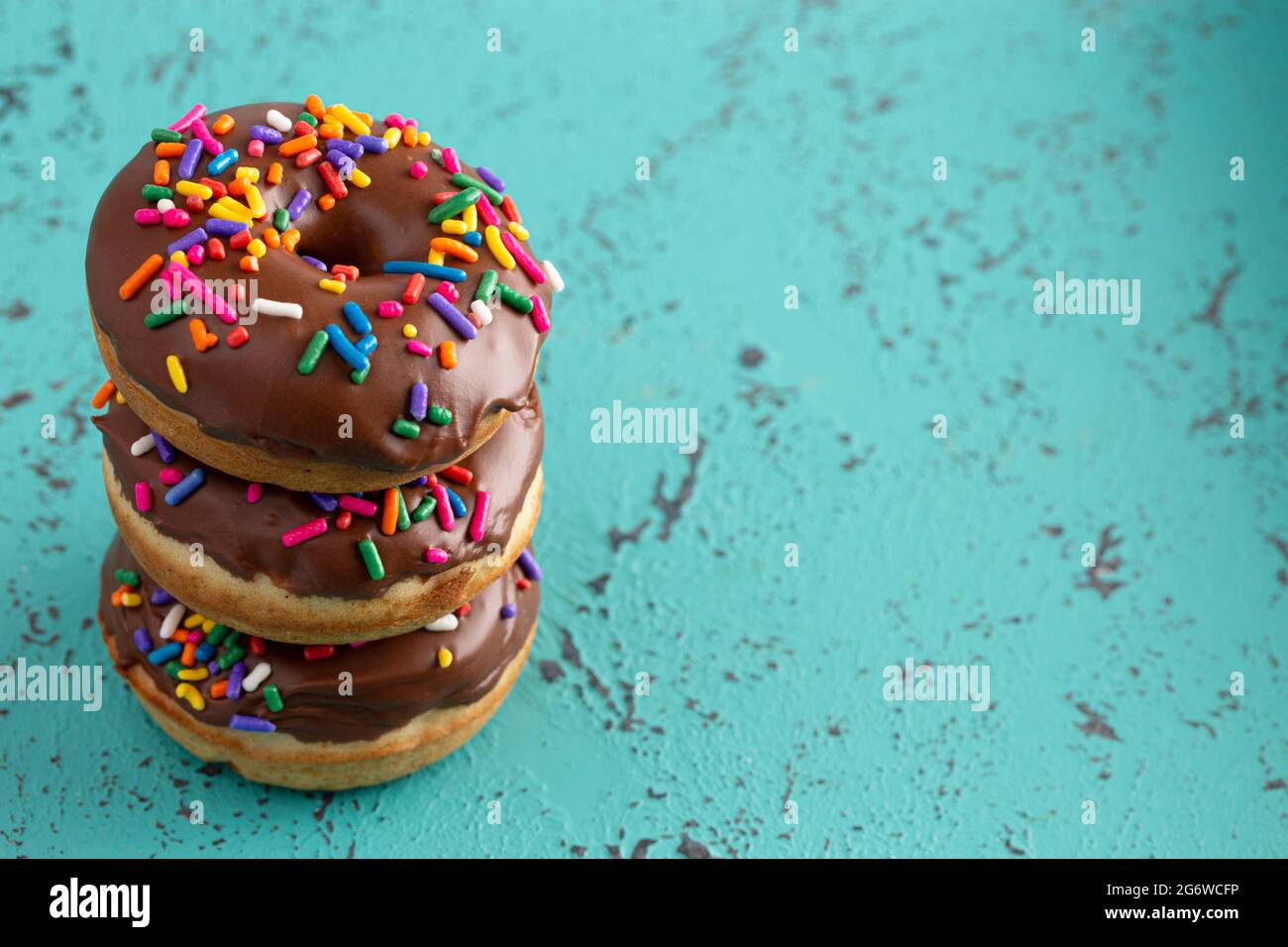 Cake Donut with Chocolate Frosting and Rainbow Colored Sprinkles Stock