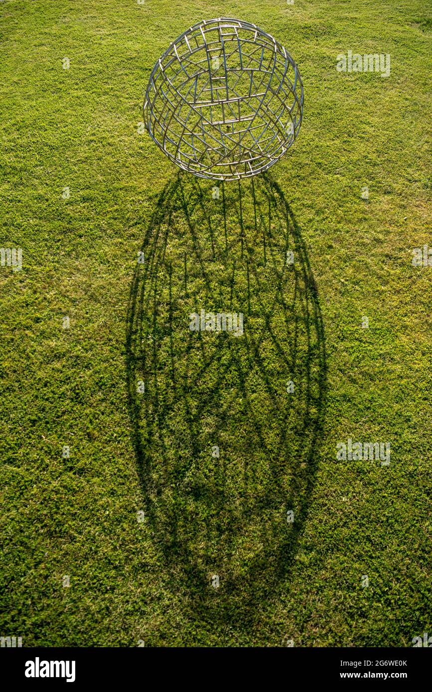 Metal sphere sculpture on grass Stock Photo Alamy