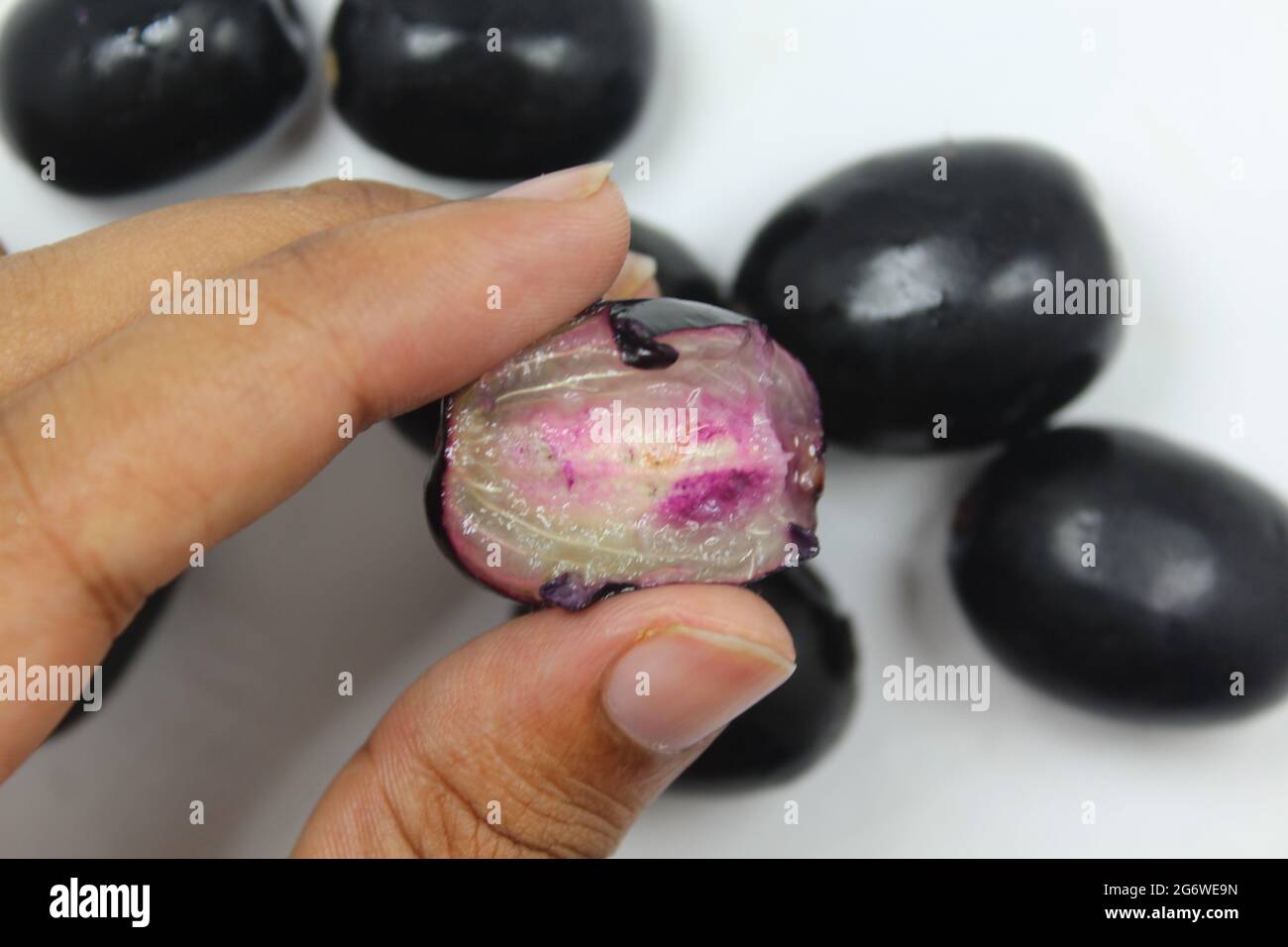 Java plum fruits on isolated white surface, juicy sweetness java plum