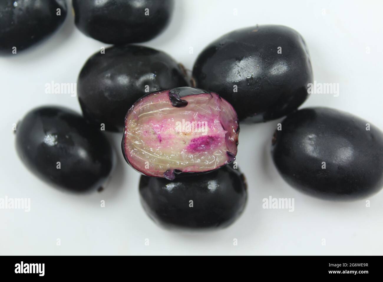 Java plum fruits on isolated white surface, juicy sweetness java plum