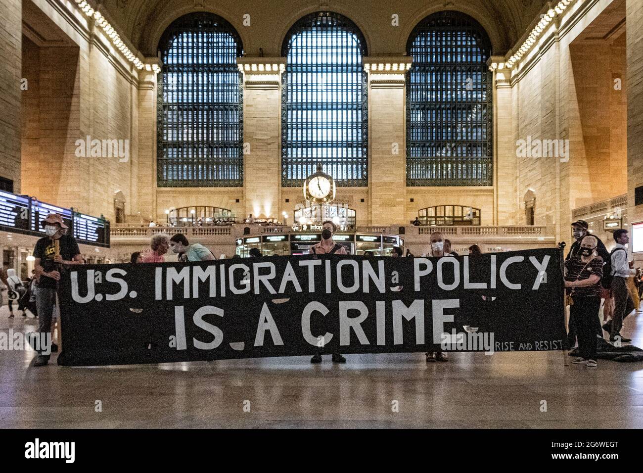 Members of the activist group Rise and Resist gathered on July 8, 2021 at the main hall in Grand Central Station for a protest demanding the Biden administration to permanently end using Title 42 exclusions to detain and deport refugees, to dismantle CBP (Customs and Border Patrol) and ICE (Immigration and Customs Enforcement), and to create a path to citizenship for all. (Photo by Erik McGregor/Sipa USA) Stock Photo