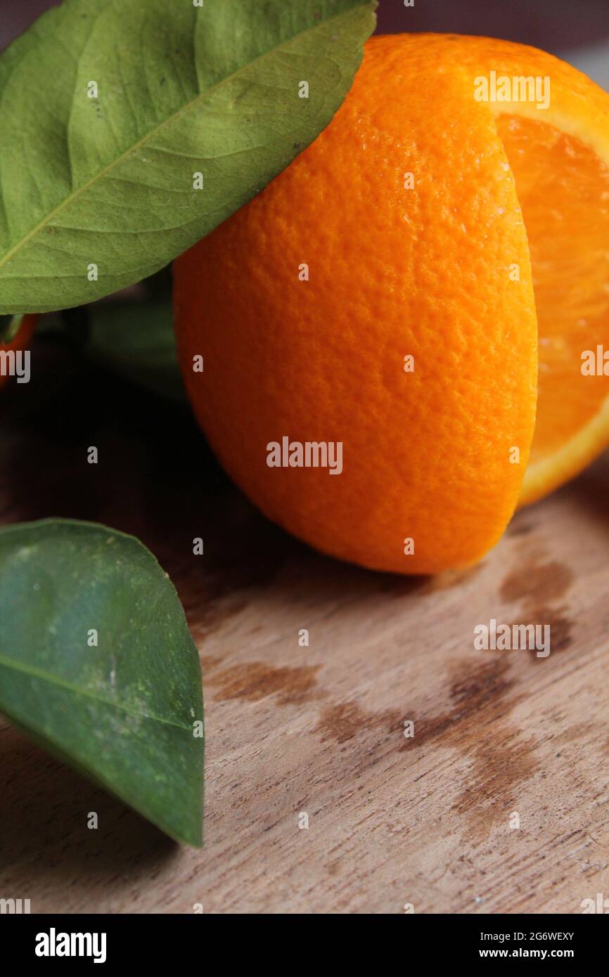 Sliced fresh malta orange fruit on wooden surface, new malta orange fruit image, isolated Stock Photo