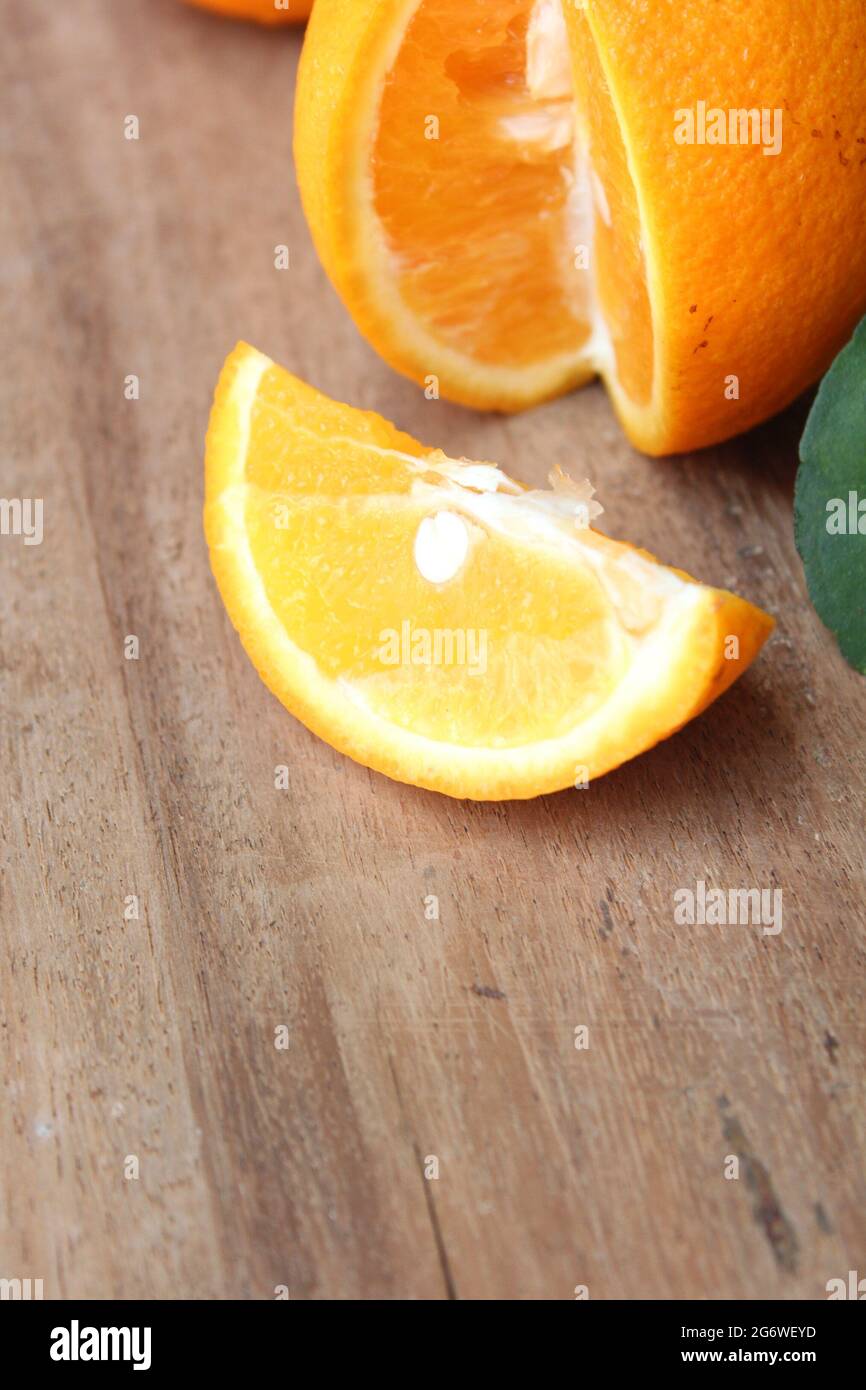 Sliced fresh malta orange fruit on wooden surface, new malta orange fruit image, isolated Stock Photo