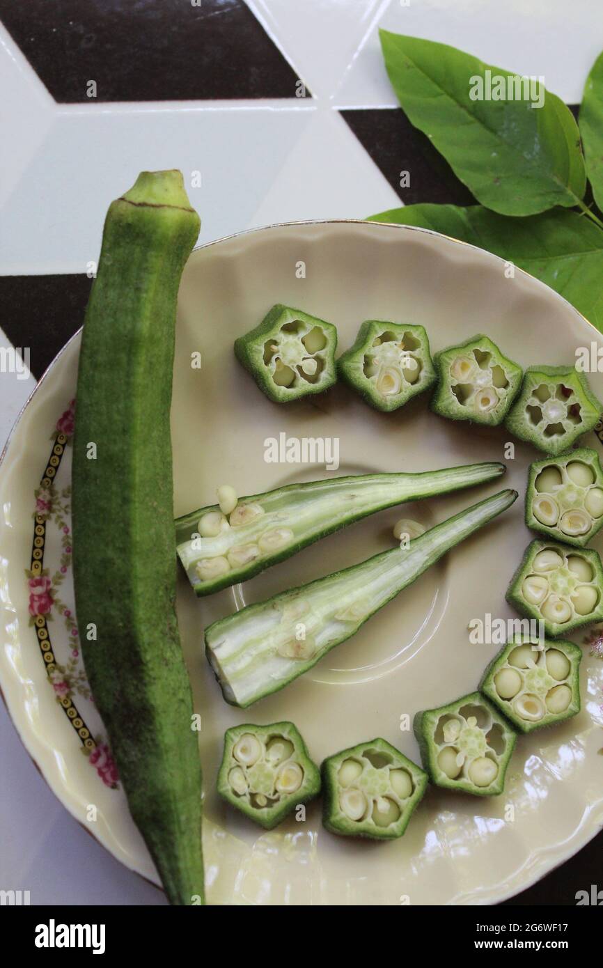 Sliced ladyfinger on isolated Stock Photo Alamy