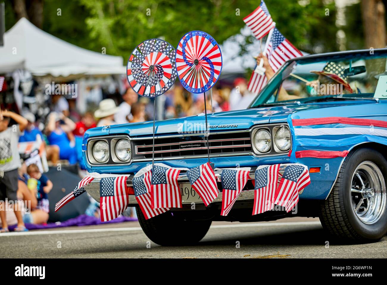 Prescott, Arizona, USA - July 3, 2021: The front of an antique car decorated with flags in the 4th of July parade Stock Photo