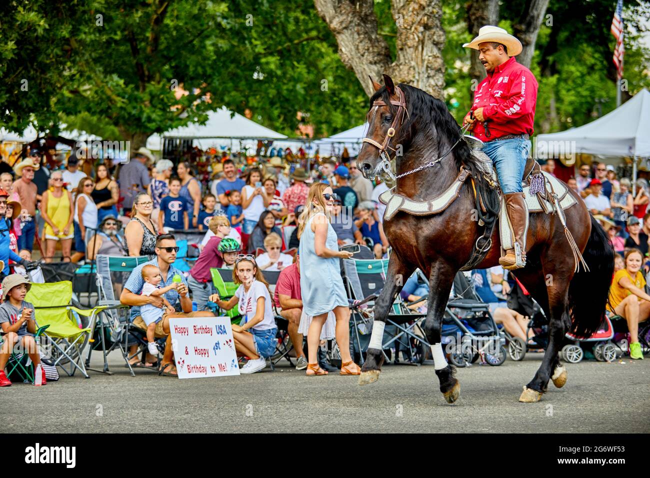 Prescott, Arizona, USA - July 3, 2021: Equestrian rider performing with his horse in the 4th of July parade Stock Photo
