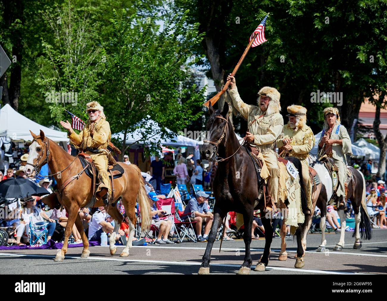 Prescott, Arizona, USA - July 3, 2021: Mountain Men horse riders marching in 4th of July parade Stock Photo