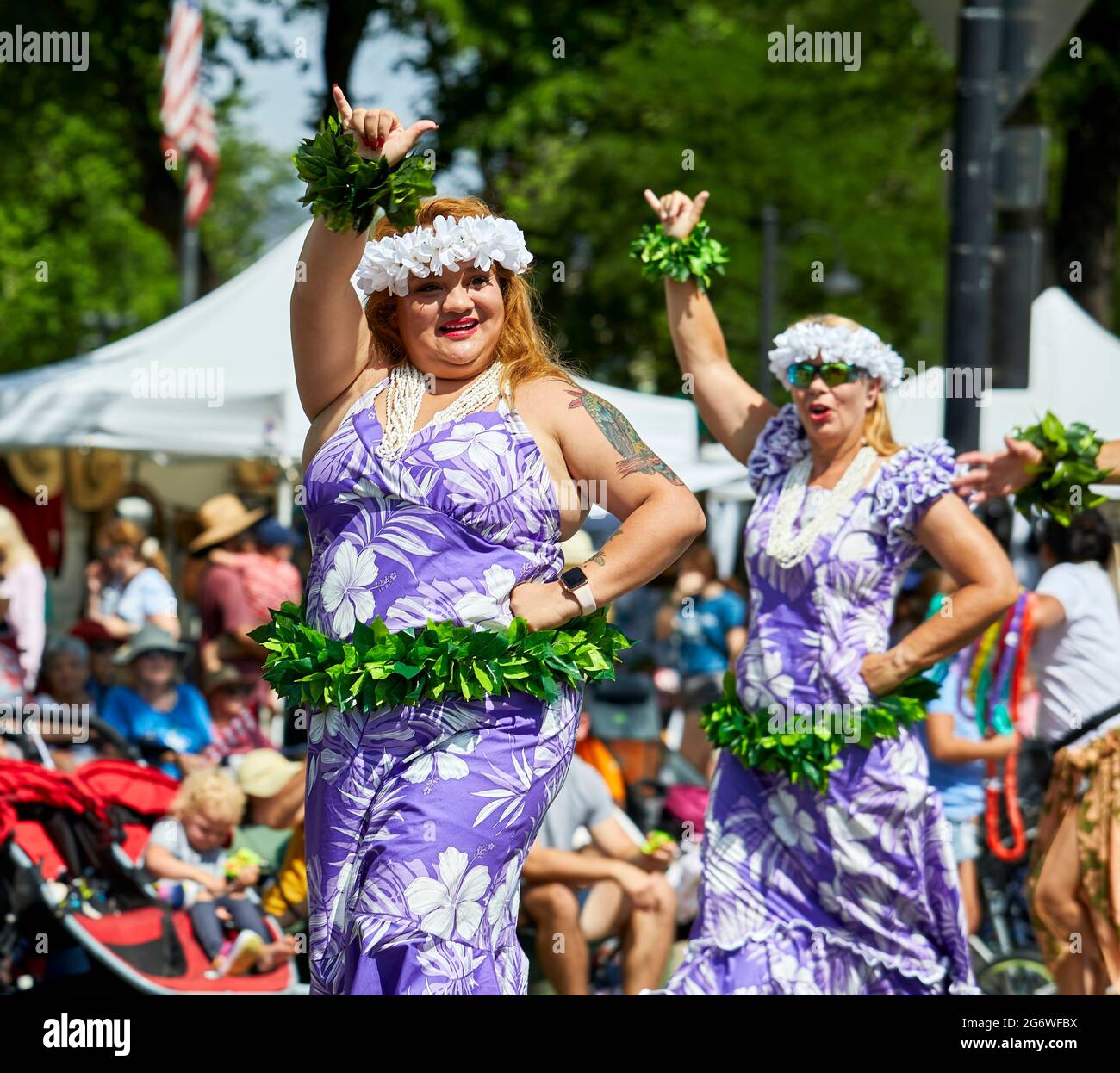 Prescott, Arizona, USA - July 3, 2021: Polynesian Siva members dancing traditional hula dances while marching in 4th of July parade Stock Photo
