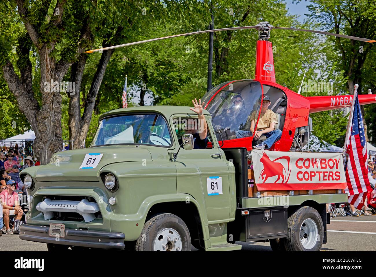 Prescott, Arizona, USA - July 3, 2021: Small helicopter used for cattle ranching in the bed of an old pick up truck in 4th of July parade Stock Photo