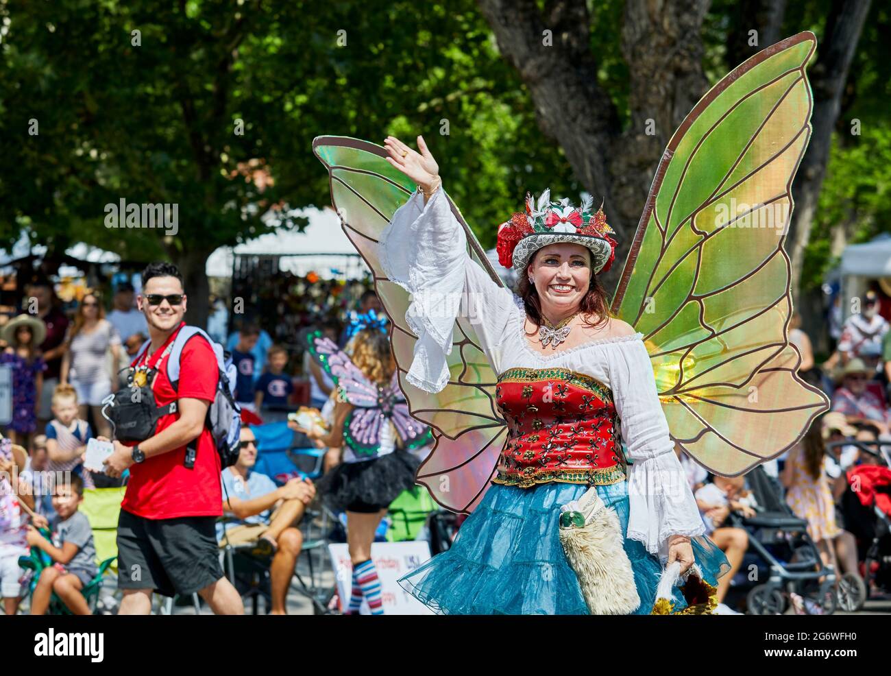Prescott, Arizona, USA - July 3, 2021: Woman dressing in a fairy costume with wings in the 4th of July parade Stock Photo