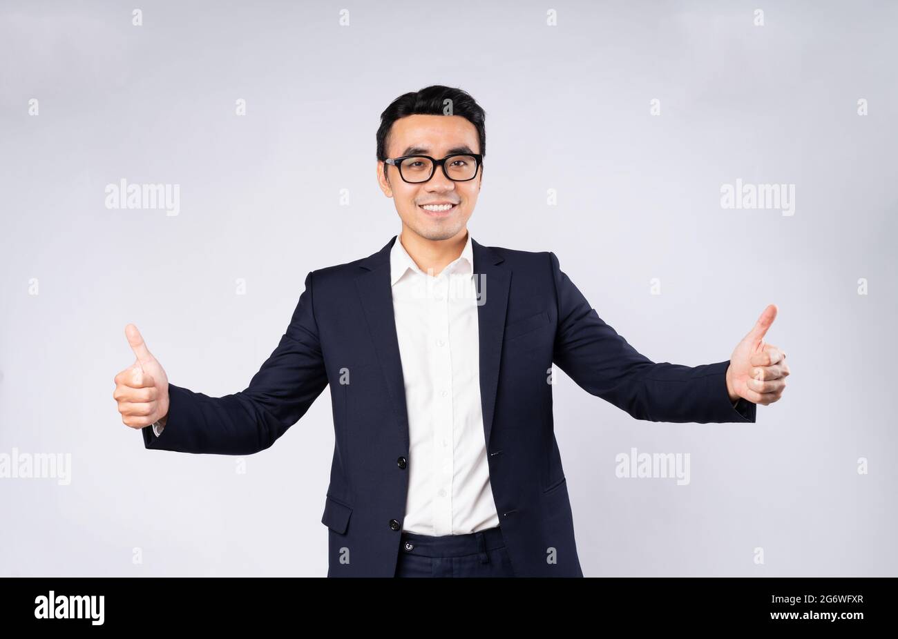 Portrait of business man wearing suit, isolated on white background ...