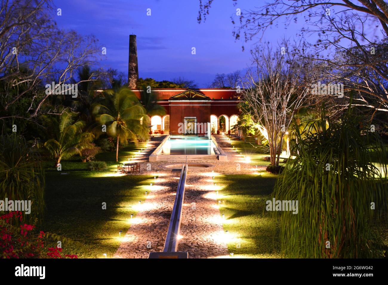 MEXICO. YUCATAN. MERIDA. VIEW OF THE SWIMMING POOL AND OF THE OLD SISAL FACTORY OF THE HACIENDA TEMOZON,  ONE OF THE FIVE HACIENDAS TRANSFORMED INTO A Stock Photo